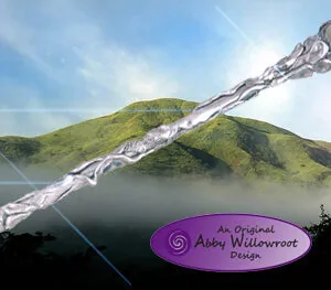 Ornate silver wand with detailed handle against misty mountainous landscape