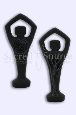 Two black decorative figurines with raised arms and spiral details on light background