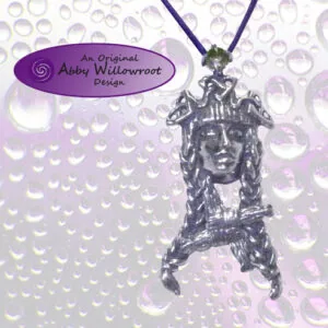 Sterling silver pendant featuring a goddess face design with Celtic imagery, hanging from dark cord on beaded background