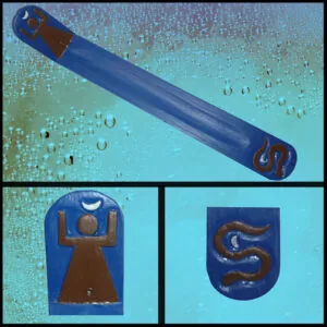 Blue incense burner with brown ceramic details and crescent moon and goddess symbols