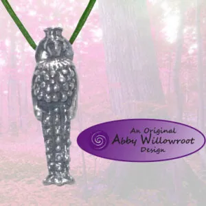 Sterling silver pendant necklace shaped like an ancient goddess figure with ornate detailing, hanging from a green cord