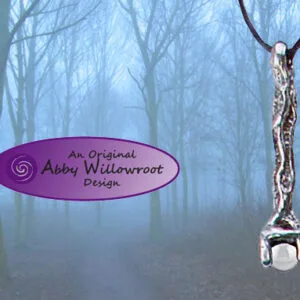 Pewter pendant wand with chainmail necklace hanging against misty forest background