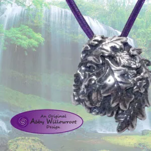 Sterling silver pendant featuring a detailed green man face with purple cord against waterfall forest backdrop