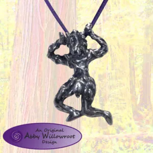Black metal pendant of a running figure with flowing hair on dark cords against a textured pale yellow and pink background