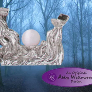 Wooden wand stand with two curved branches holding a white sphere, forest background