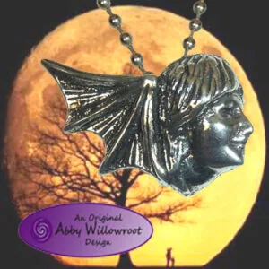 Pewter pendant featuring a profile of a woman with flowing hair and bat wings, hanging from a beaded chain against a yellow moon backdrop