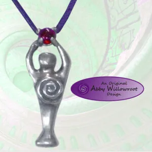 Silver pendant with spiral design and red gemstone on purple cord