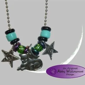 Pair of metal cat charm necklaces with turquoise and black beads, green crystals, and star charms hanging from silver chains