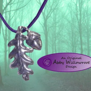 Silver oak leaf and acorn pendant hanging from purple cord against misty forest background