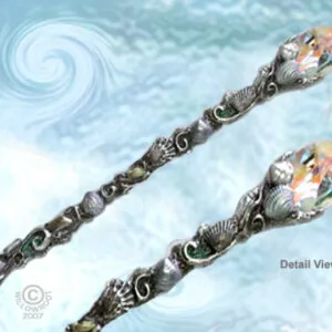 Two ornate wands with silver-toned bodies and gemstone heads featuring ocean and nature motifs, displayed against a blue textured background with one showing detail view
