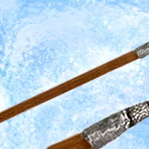 Two wooden wands with ornate silver finials against a blue textured background