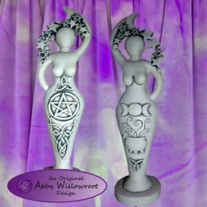Two white goddess statues with decorative symbols on purple tie-dye fabric background