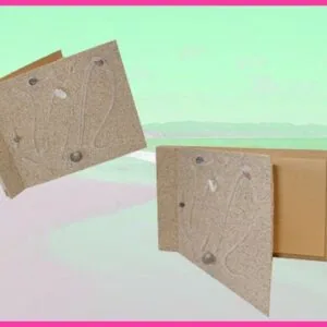 Two cork-textured journal covers with decorative lines and stones against a pastel beach background