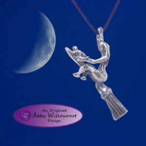 Sterling silver pendant featuring a figure reaching toward a crescent moon against deep blue background
