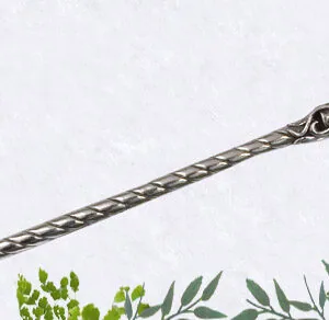 Ornate silver wand with twisted shaft and decorative floral knob, displayed on white background with green foliage at bottom