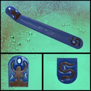 Blue incense burner with triple moon goddess designs on ends and decorative motifs