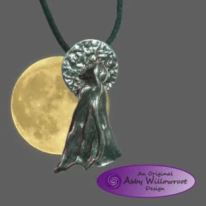 Pewter pendant featuring a figure silhouette with textured circular top, hanging from green cord with yellow moon backdrop