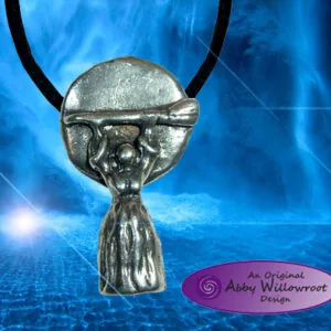 Pewter pendant featuring a stylized witch head with pointed hat on black cord against blue mystical background